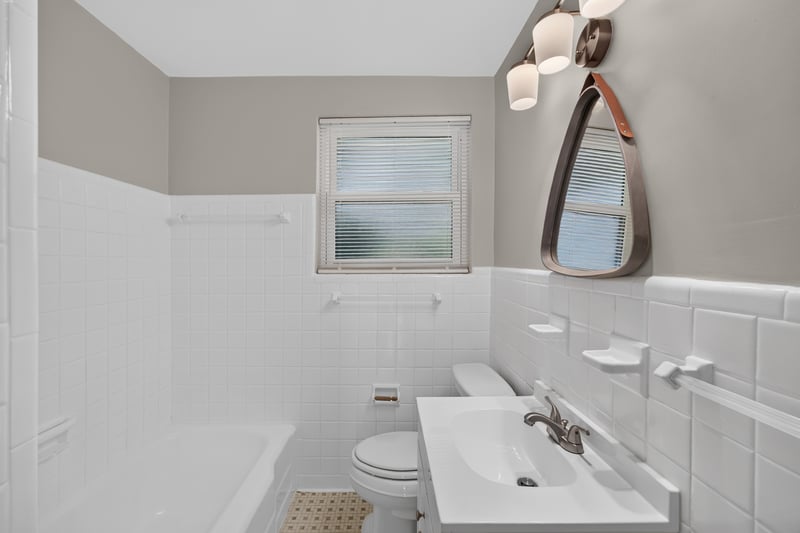 Bathroom with tub and tiled walls at 6338 Mercer Cir W, Jacksonville, FL