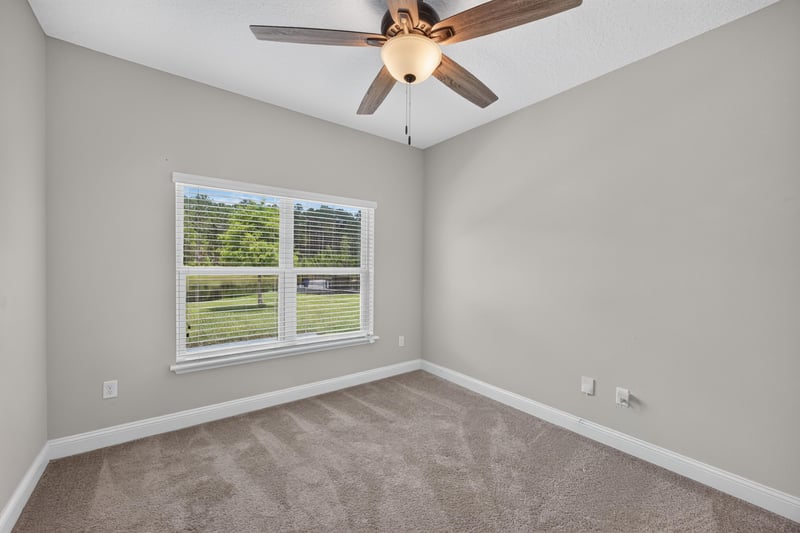 Bedroom with window and carpet at 53 Lumen Ct, St. Augustine, FL 32095