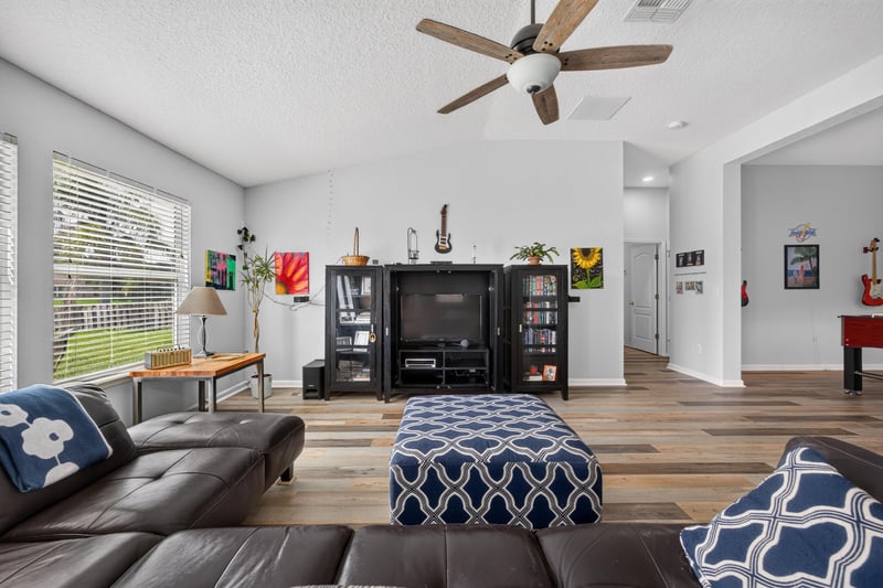 Living room with television and bookshelf at 2065 Creekmont Dr