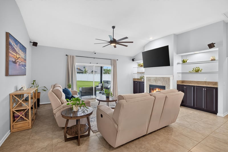 Living room with vaulted ceiling and ceiling fan at 538 Porta Rosa Circle, St. Augustine, FL 32092