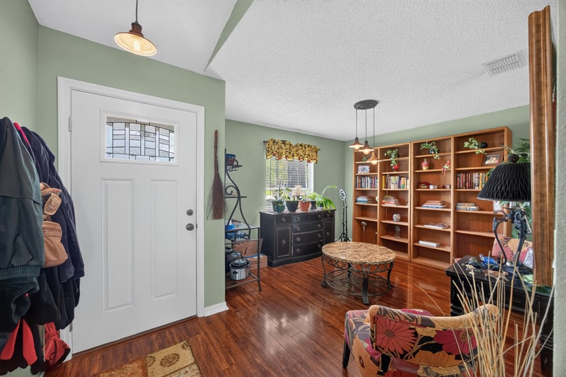Entry with coat hooks and wood floors at 145 Dover Bluff Dr, Orange Park, FL