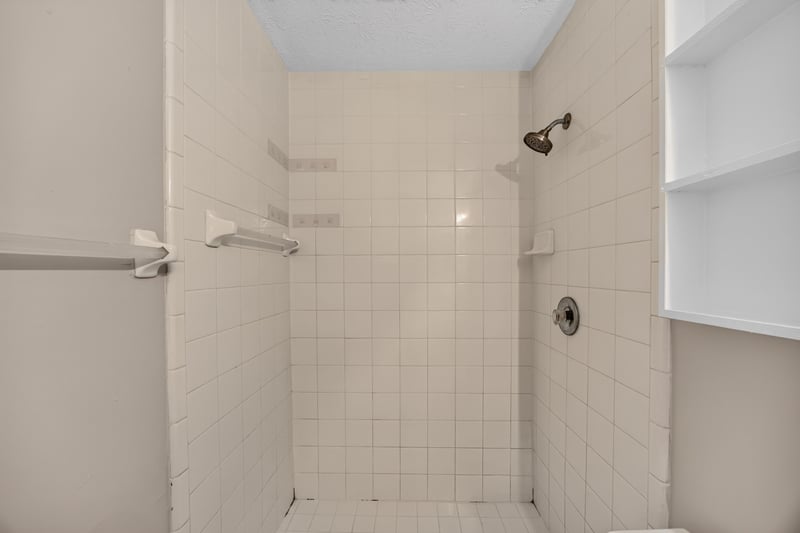 Bathroom shower with tile surround at 1083 Stokes St, Jacksonville, FL