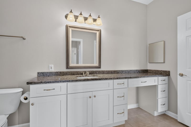 Bathroom vanity with mirror and lighting at 7990 Baymeadows Rd E #404, Jacksonville, FL 32256