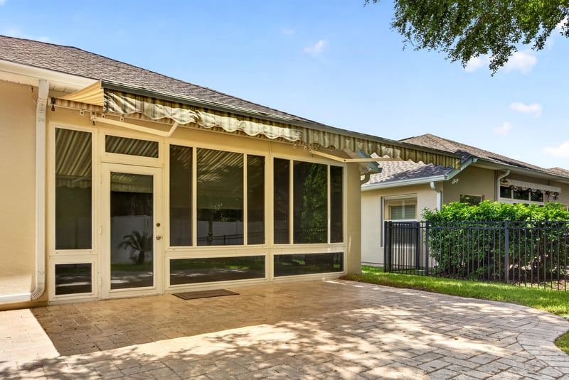 Screened porch exterior with awning at 11225 Water Spring Cir, Jacksonville, FL 32256