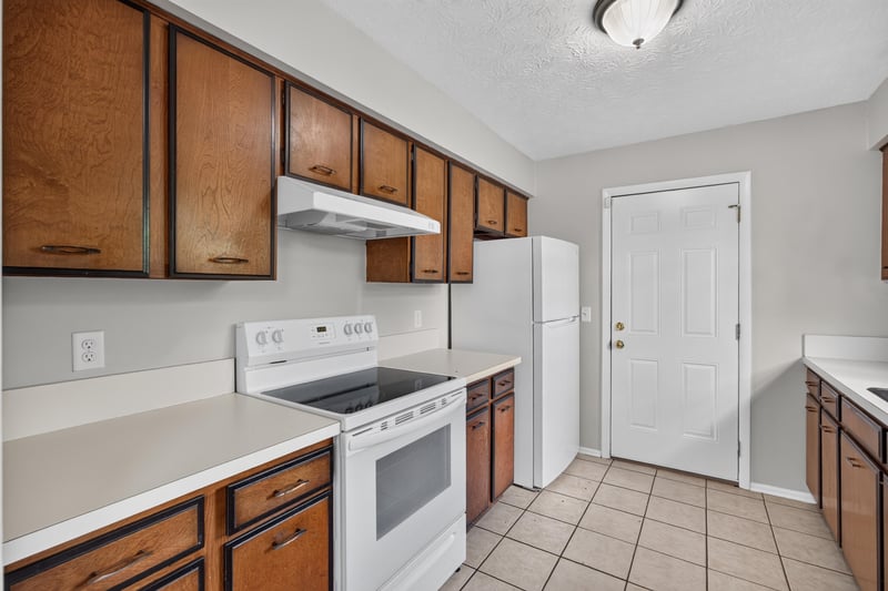 Kitchen with electric range and tile flooring at 1083 Stokes St, Jacksonville, FL