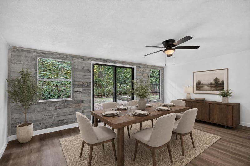 Staged dining area with wood table and accent wall at 3113 Kline Rd, Jacksonville, FL 32246