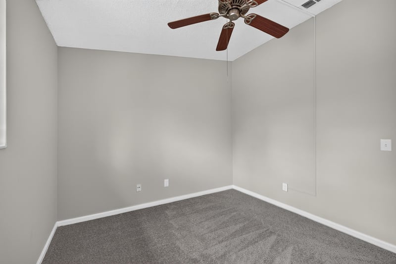 Empty bedroom corner with ceiling fan at 3801 Crown Point Rd, Jacksonville, FL 32257