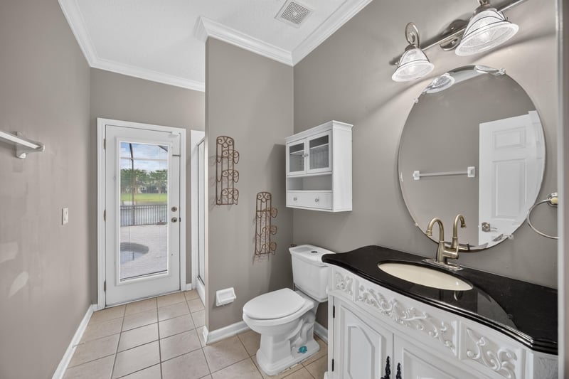 Bathroom with double vanity and tile floor at 1493 Greyfield Dr, St. Augustine, FL 32092