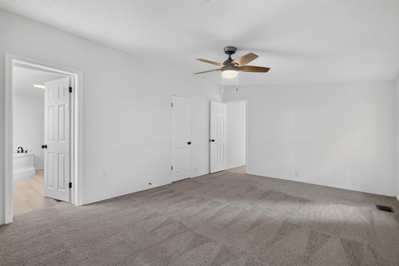Bedroom with carpet and ceiling fan at 55520 Jewel-Thomas Rd, Callahan, FL 32011