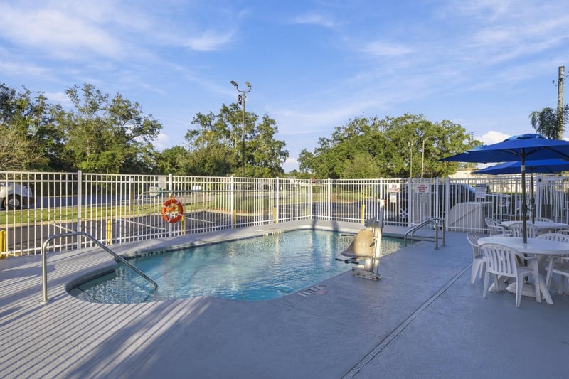 Pool area with umbrella, photographed by Megapixeler on Eldridge Loop, Orange Park