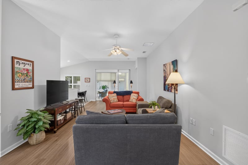 Living room with television and seating at 11225 Water Spring Cir, Jacksonville, FL 32256