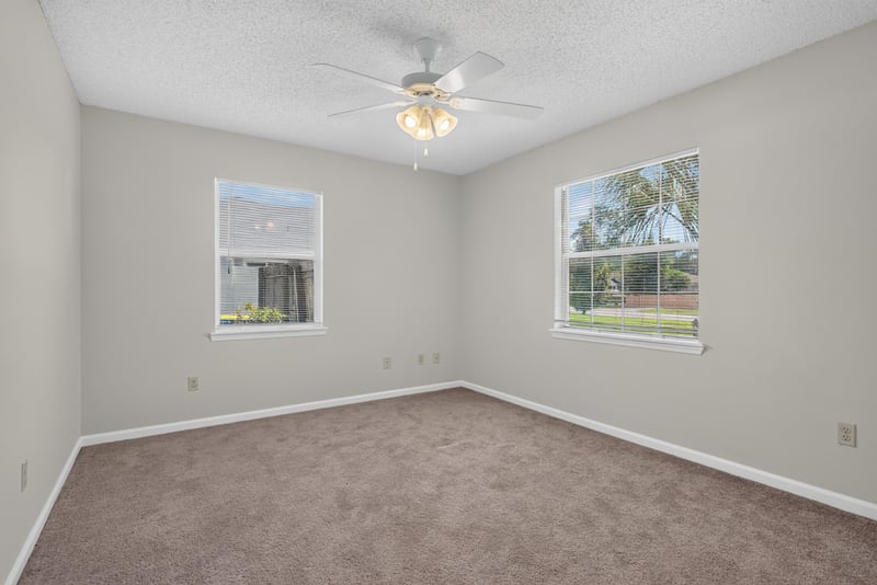 Bedroom with ceiling fan and two windows at 400 Ashcroft Landing Dr, Jacksonville, FL 32225