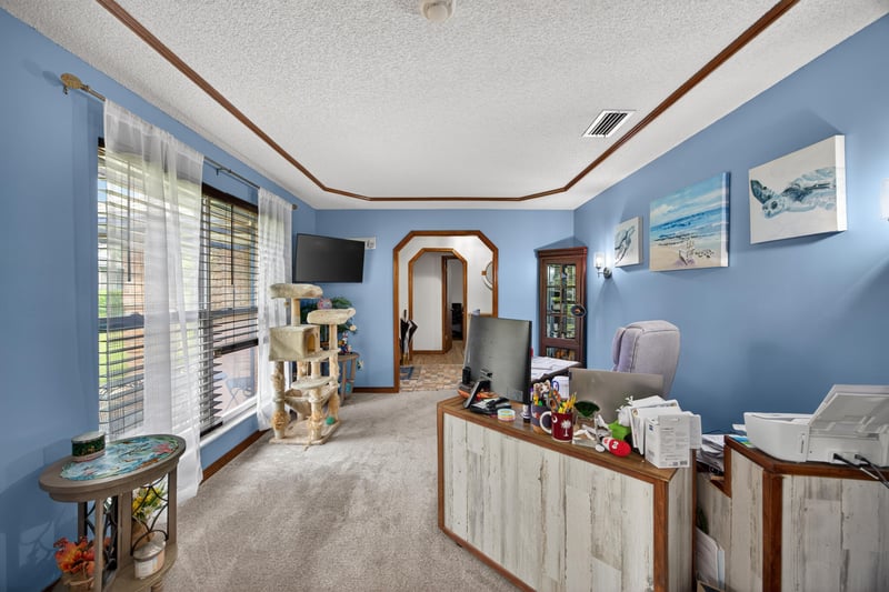 Bedroom used as office with blue walls at 981 Marble Ridge Dr, Orange Park, FL 32065