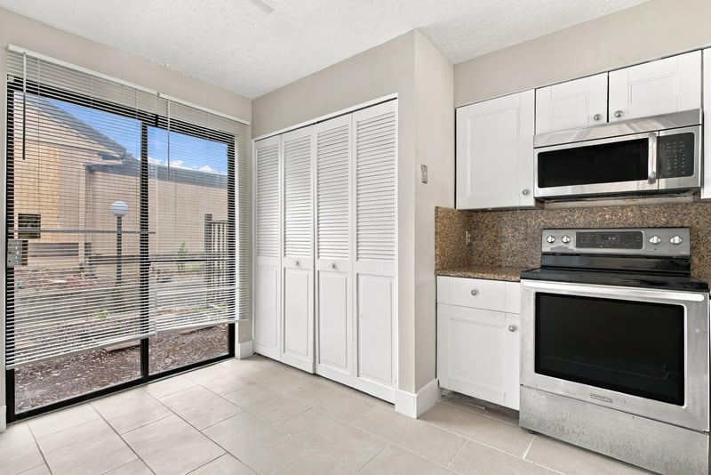 Dining area with closet doors and sliding glass door at 7703 Las Palmas Way