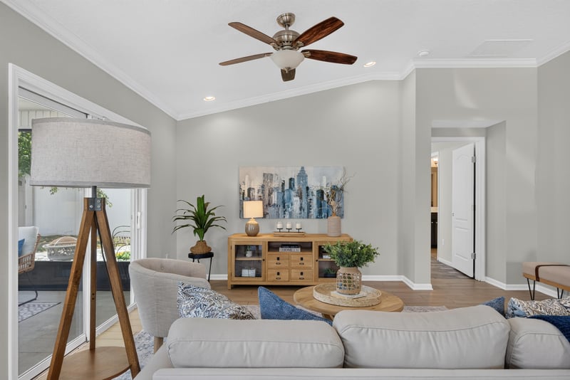 Living room corner with floor lamp and area rug at 10066 Andean Fox Dr, Jacksonville, FL 32222