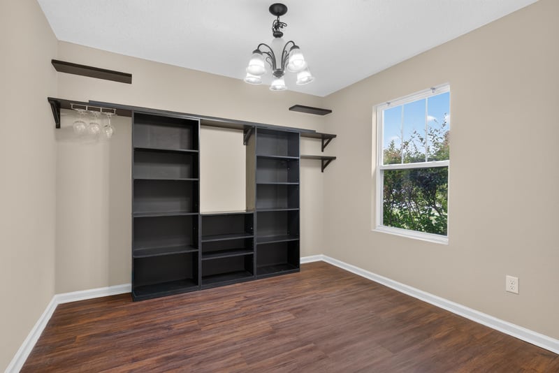Flex room with built-in closet shelving, unstaged at 7253 Townsend Village Ct, Jacksonville, FL