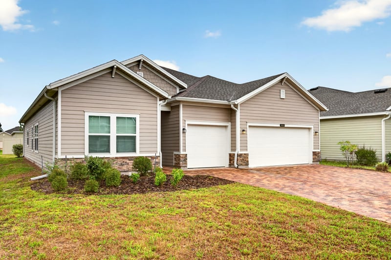 Front exterior from street corner at 9905 Ansley Lake Dr, Jacksonville, FL