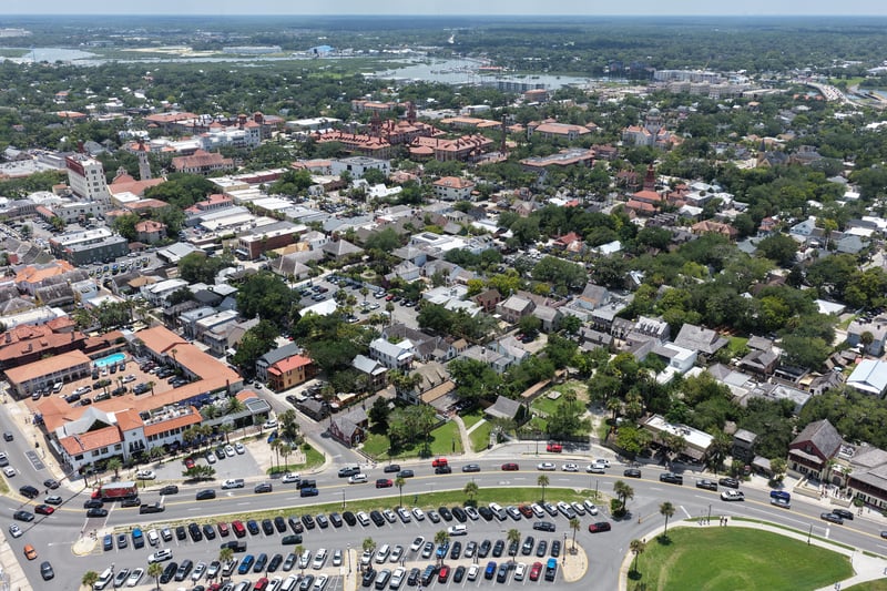 Aerial view of downtown rooftops and parking areas in St. Augustine, FL