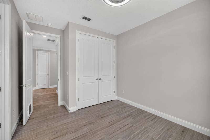 Bedroom with double closet doors at 91 Tilloo Ct, St. Johns, FL