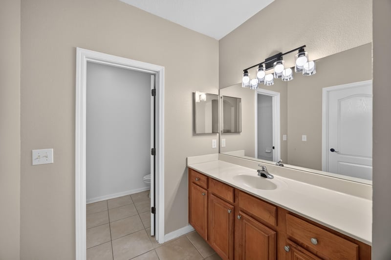 Bathroom vanity with mirror and light fixture at 3750 Silver Bluff Blvd, Orange Park, FL