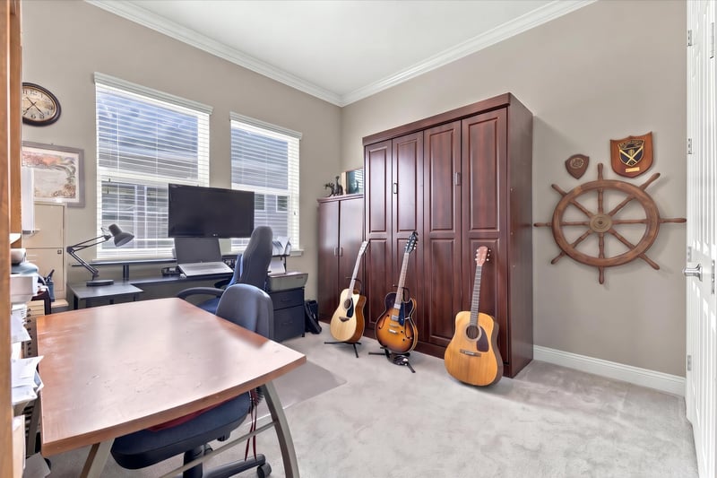 Home office with guitars and desk, photographed by Megapixeler on Lucena Ln, Jacksonville, FL