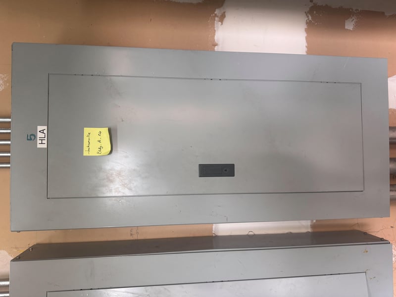 Panel cover labeled HLA at 11700 New Kings Rd, Jacksonville, FL 32219