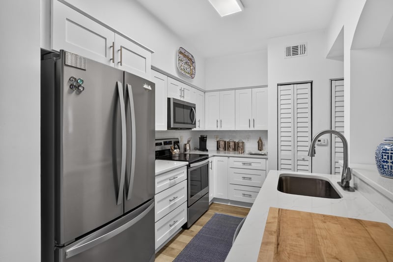 Kitchen view toward refrigerator and range at 10435 Mid Town Pkwy unit 135, Jacksonville, FL 32246