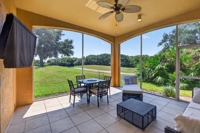 Covered lanai with tile floor and outdoor seating at 140 Ave De La Mer, Palm Coast, FL 32137