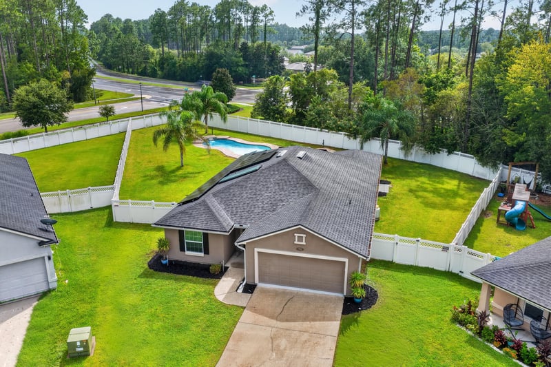 Aerial view of backyard pool near road at 706 Grampian Highlands Dr, St. Johns, FL 32259