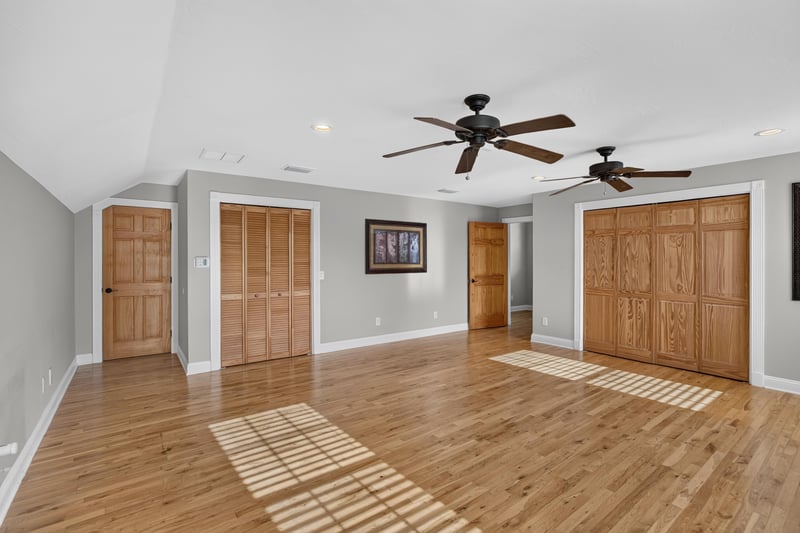 Bonus room with built-in closets and hardwood floors at 1735 Hagans Ridge Ct