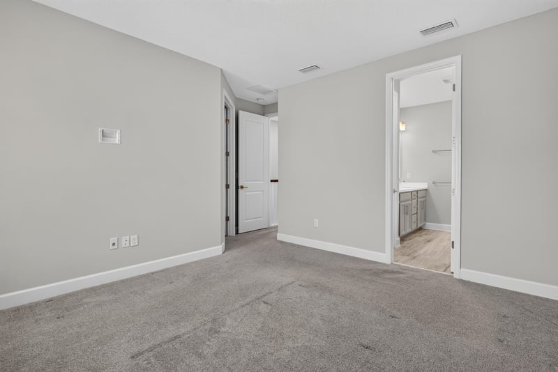 Bedroom with door to adjoining room at 7446 Loggerhead Ct, Jacksonville, FL 32256