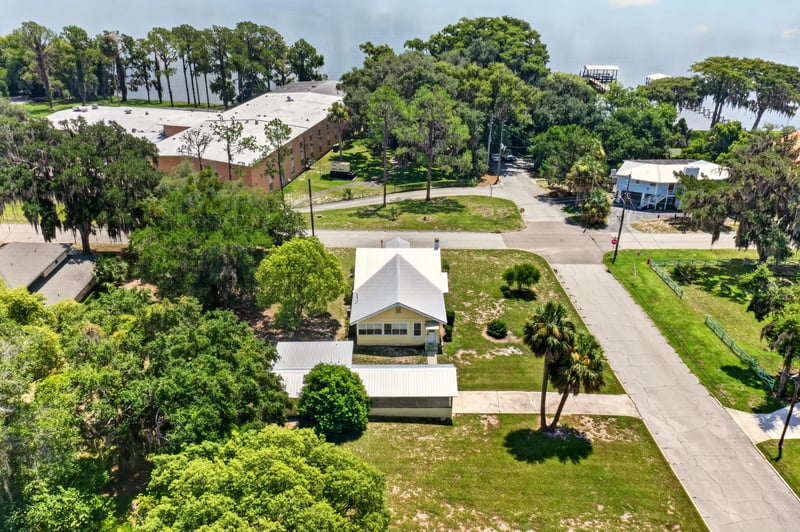 Drone view of house among trees at 101 N Lake St, Crescent City, FL