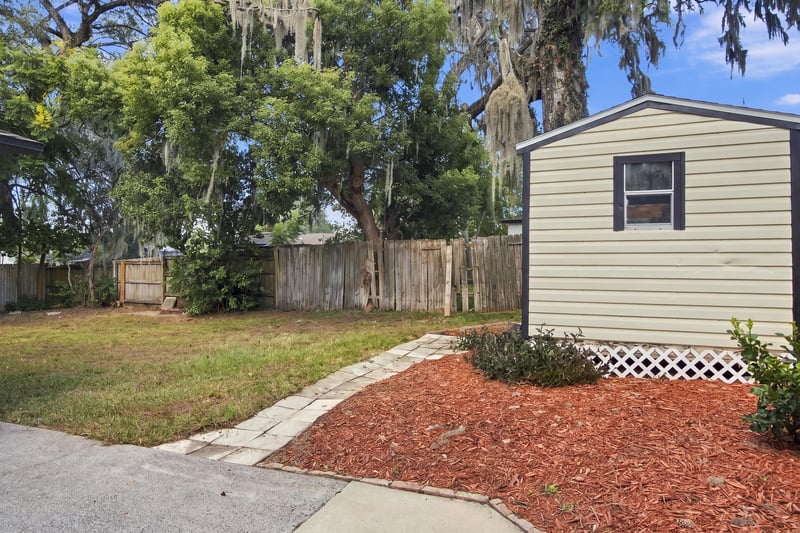 Backyard with storage shed and fence at 417 Capricorn Ln, Orange Park, FL 32073