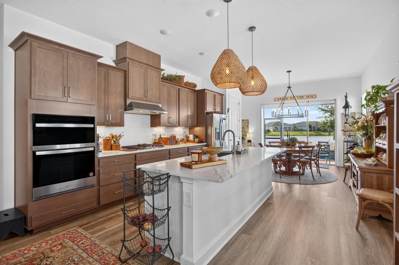 Kitchen with dark cabinetry and built-in oven at 129 Amberwood Dr, St. Augustine, FL
