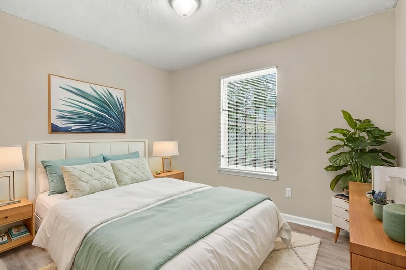 Bedroom with bed and side table, staged, at 219 Shortreed St, Jacksonville, FL 32254