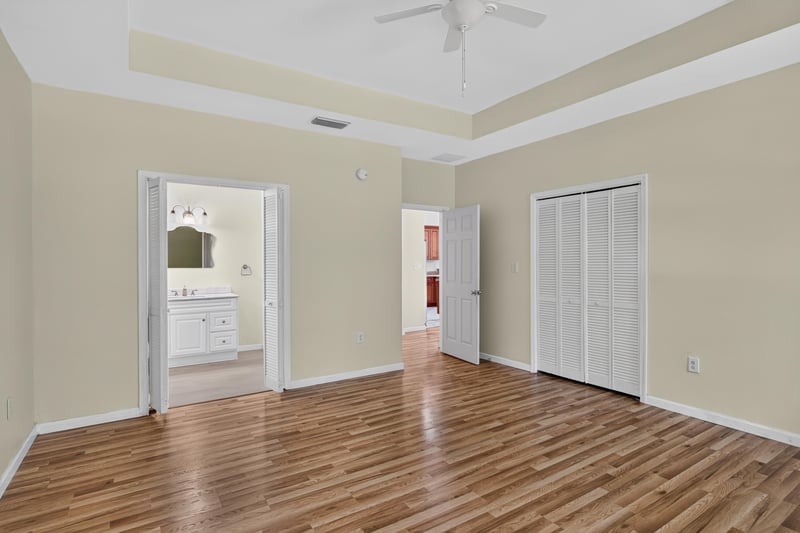 Hallway with tray ceiling and closet doors at 1012 Fruit Cove Rd, Jacksonville, FL 32259