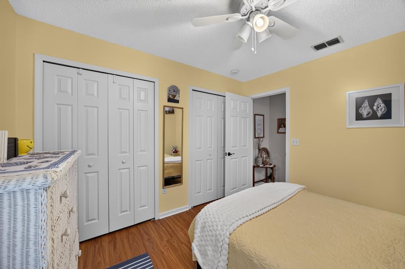 Bedroom with closets and twin beds at 13514 Las Brisas Way N, Jacksonville, FL