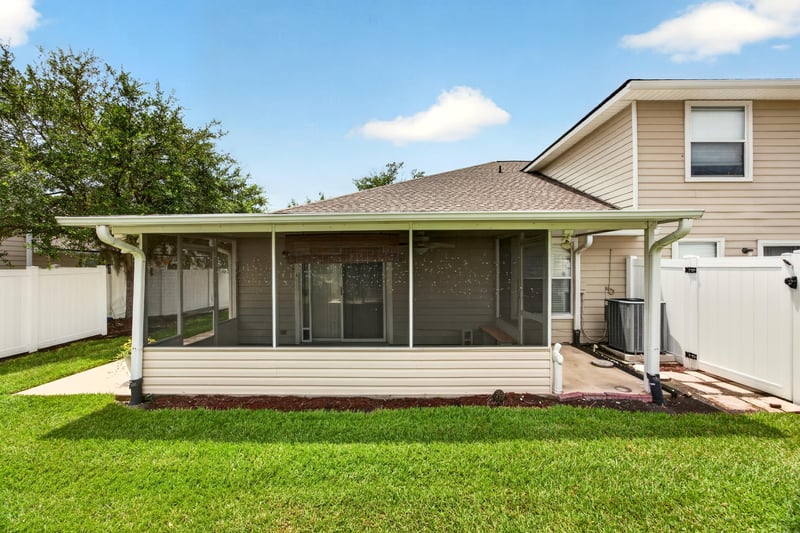 Screened porch and fenced backyard at 605 N Covered Bridge Rd, Jacksonville, FL