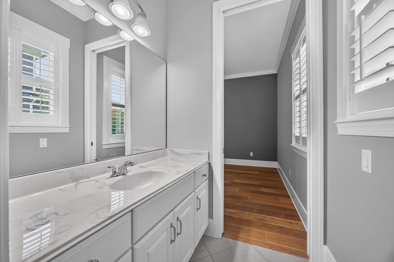 Bathroom vanity with plantation shutters at 186 Freshwater Dr
