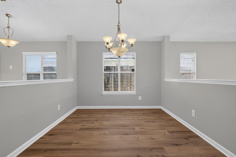 Dining area with chandelier and windows at 1108 Hidden Cove Cir S, Atlantic Beach, FL 32233