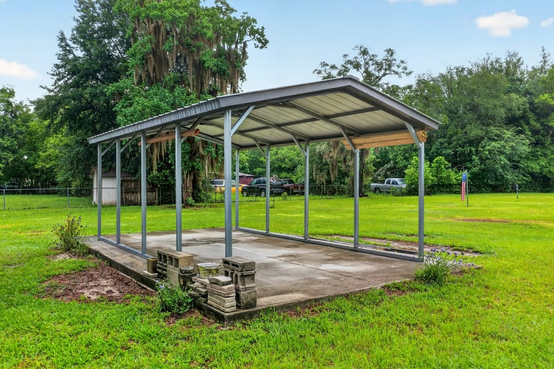 Metal carport structure over a concrete pad at 1619 Hammond Blvd, Jacksonville, FL