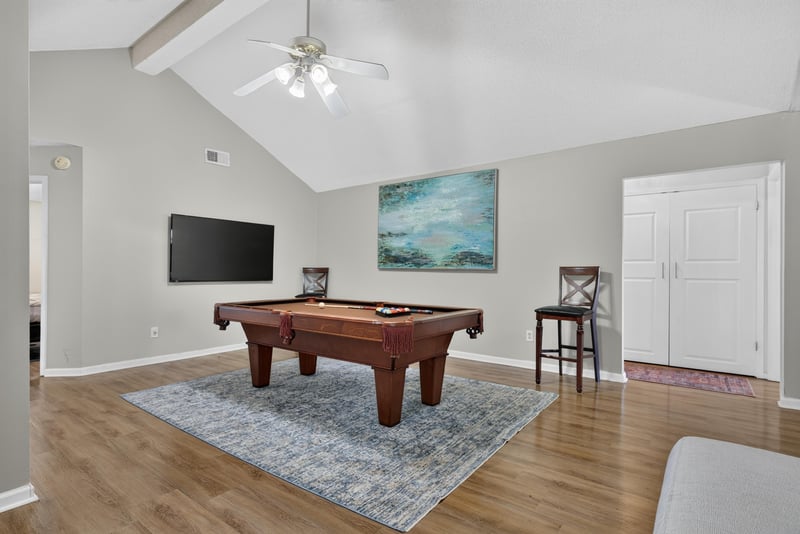 Living room with pool table and ceiling fan at 8680 Bandera Cir S, Jacksonville, FL 32244