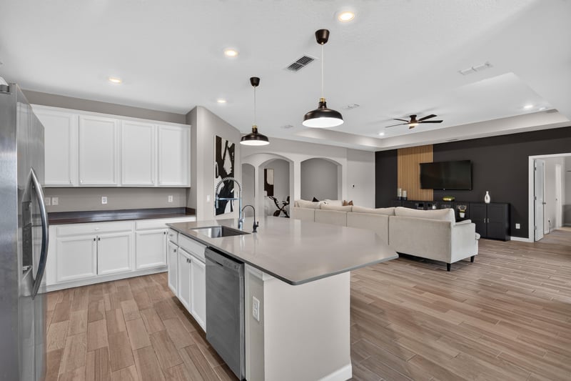 Kitchen island open to living room at 9942 Lovage Ln, Jacksonville, FL 32219