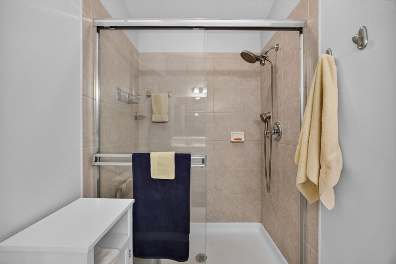 Primary bathroom glass-enclosed shower at 11225 Water Spring Cir, Jacksonville, FL 32256