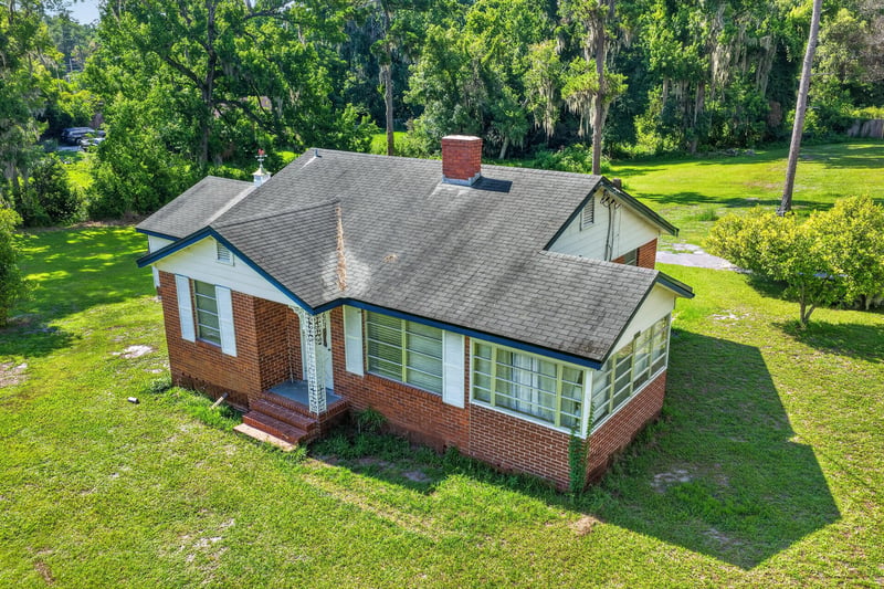 Close front exterior showing porch and windows at 5745 110th St, Jacksonville, FL 32244