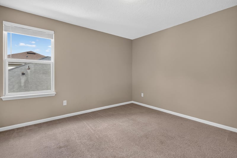 Bedroom with carpet and window at 13685 Goodson Pl, Jacksonville, FL 32226