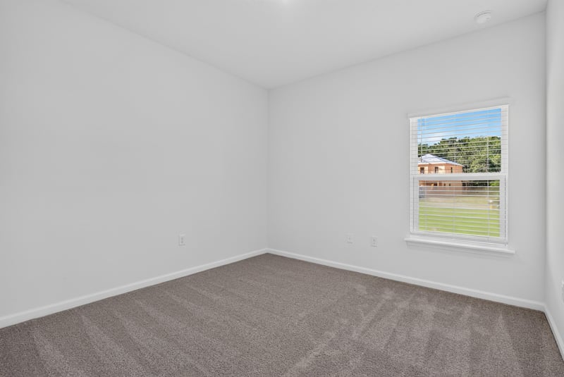Empty carpeted bedroom with window at 269 Bluegrass Wy, St. Augustine, FL 32092