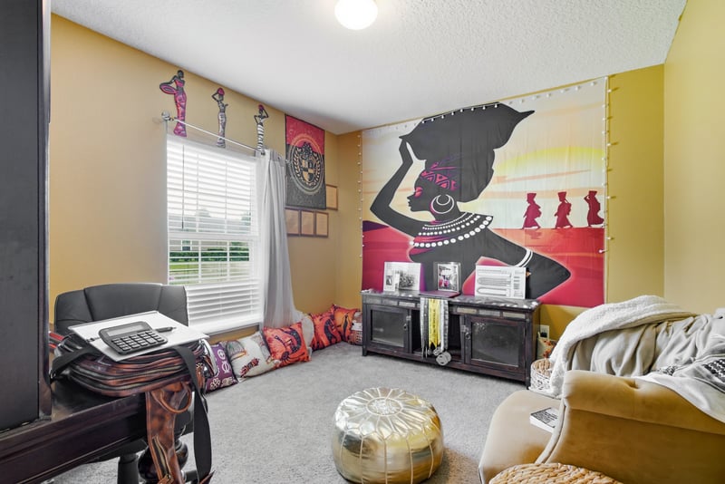 Bonus room with wall art and seating at 7392 Timber Falls Ct