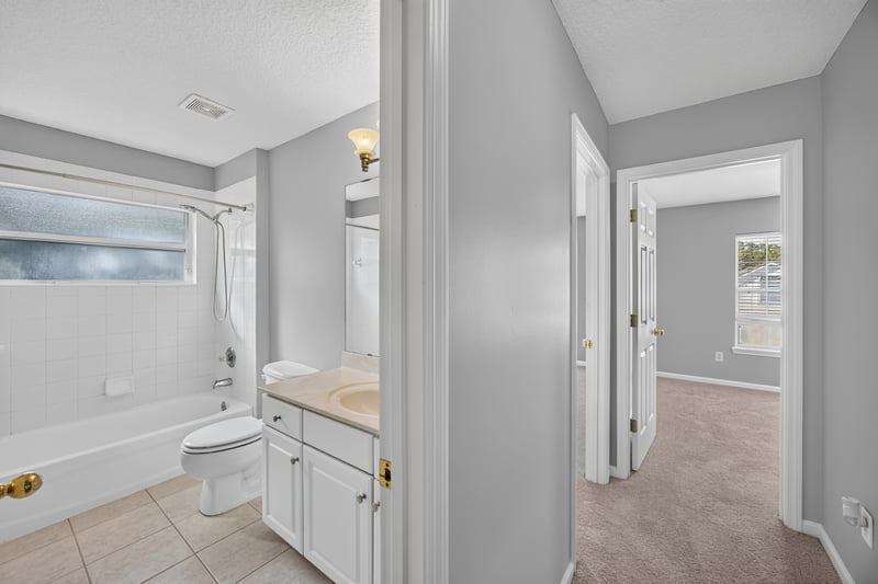 Bathroom vanity and toilet at 470 Sparrow Branch Cir, Jacksonville, FL 32259