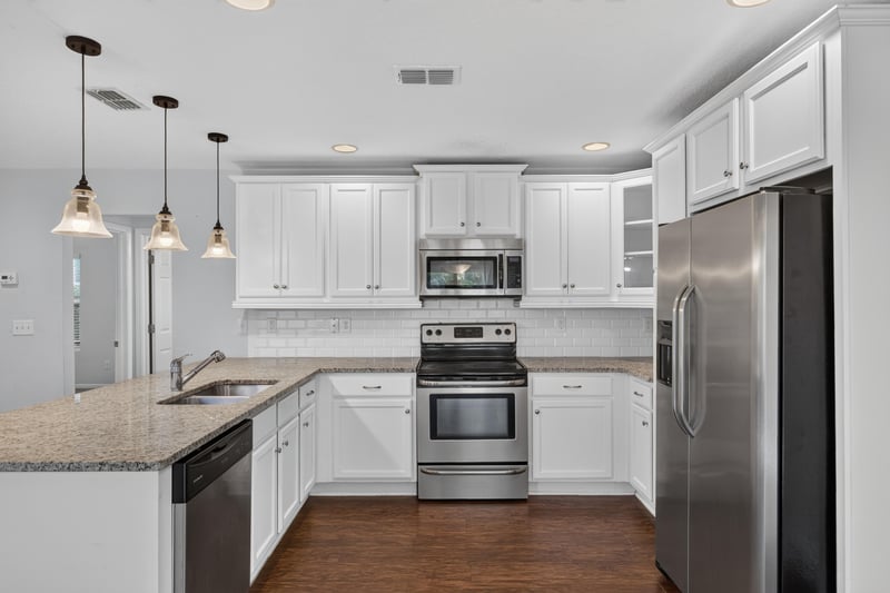 Kitchen with pendant lights and stainless appliances at 1002 Ingleside Ave, Jacksonville, FL 32205